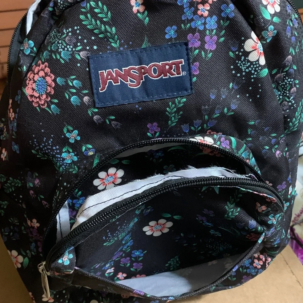 Jansport Black Mini Backpack with Pink, Purple & Green Floral Print.